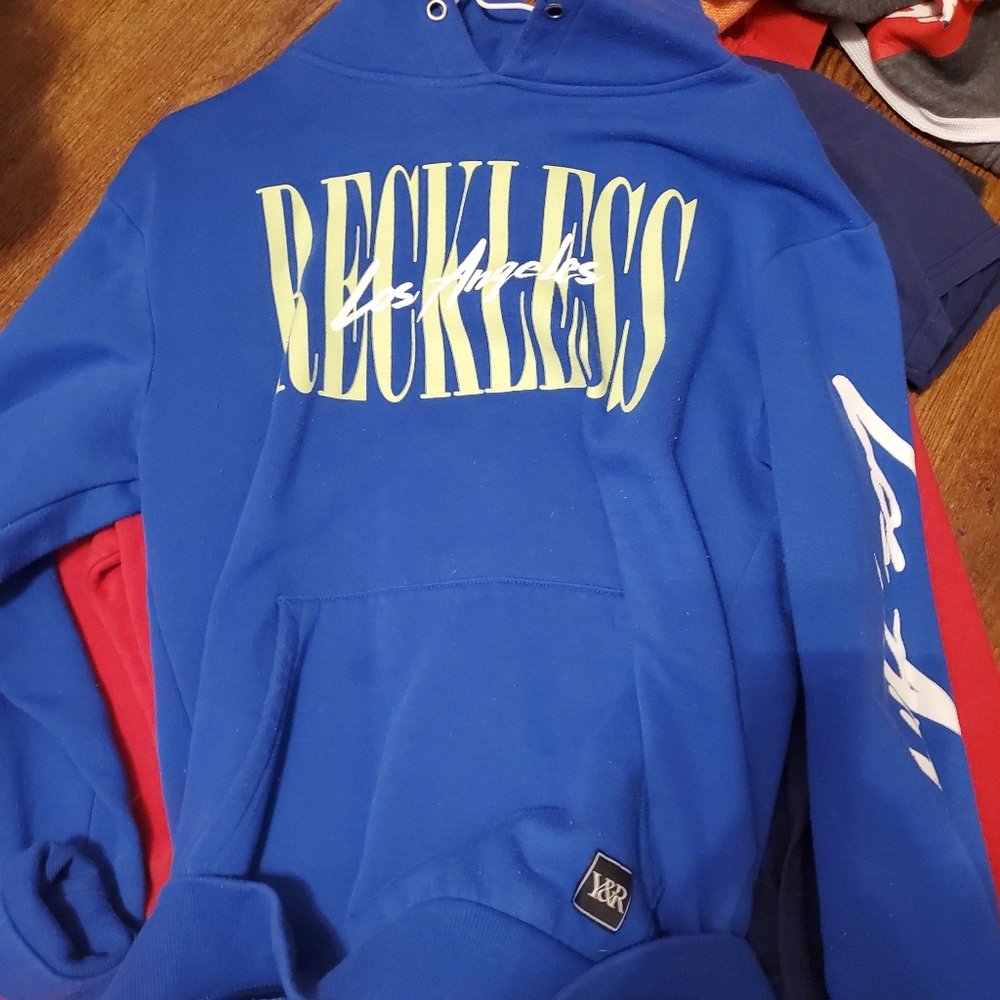 Young and reckless sweater